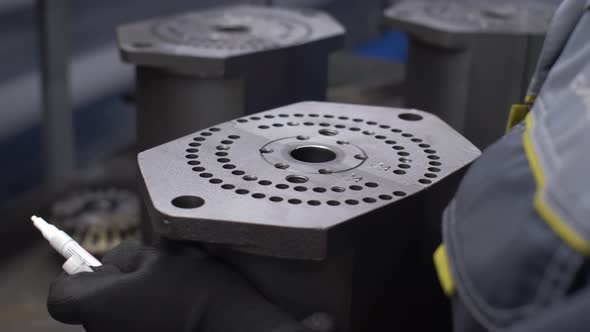 The Hands of the Worker at the Plant Check and Evaluate the Manufactured Part for Quality Factory alt