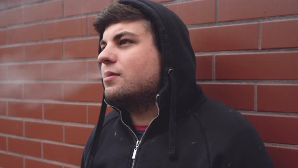 Young Man Smoking Cigarette