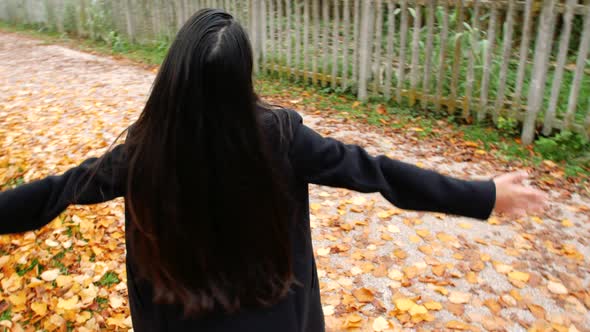 Portrait of a young woman in autumn.