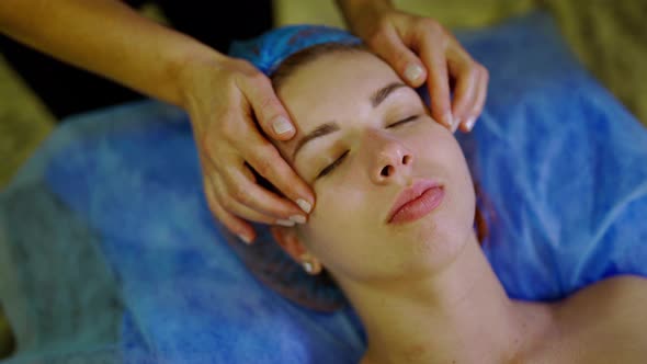 Relaxing Beautiful Woman Having A Massage On A Face Stock Footage