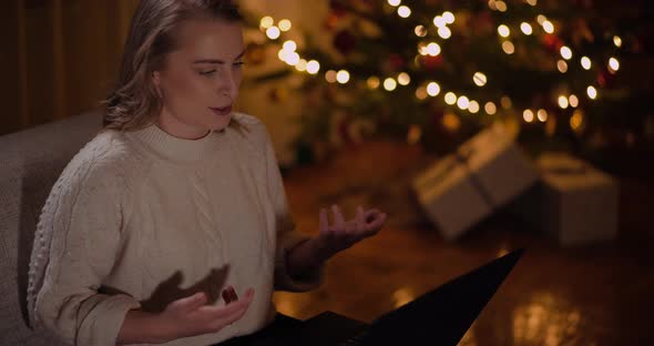 Woman Doing Online Work During Christmas Holidays at Home alt