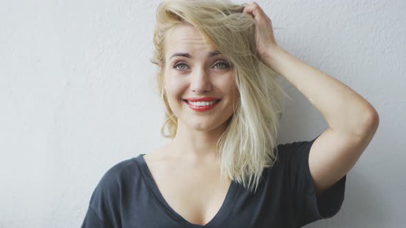 Attractive Cheerful Young Blond Woman alt