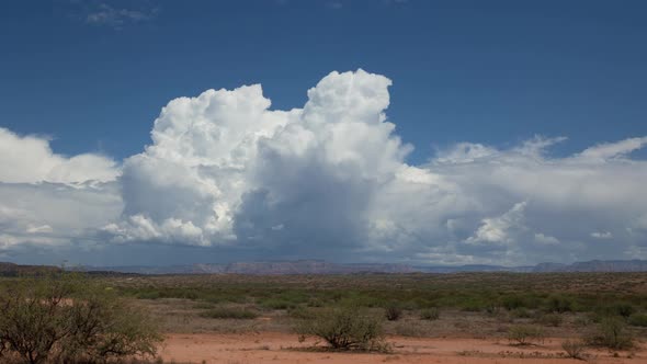 Bubbling Cumulus Clouds in High Desert Landscape Zoom in Timelapse