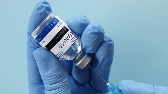 COVID19 Vaccine in Researcher Hands alt