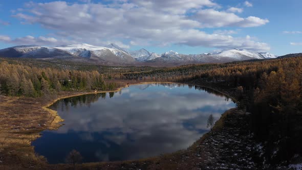 Flying Over the Beautiful Mountain Lake in Altai Mountains, Siberia, Russia. Aerial View