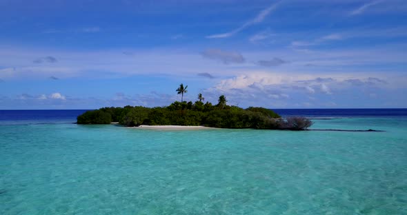 Beautiful aerial abstract shot of a white sandy paradise beach and aqua blue water background in hig alt