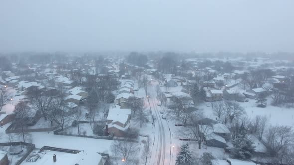 tilting up drone shot of snow in Westerville Ohio alt