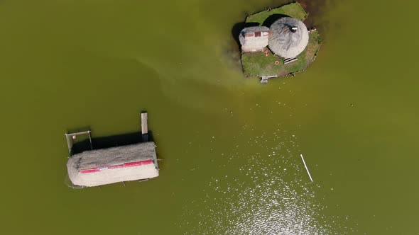 Fascinating zoom out 4k aerial view over the green water of the laguna de los milagros in Tingo Mari alt