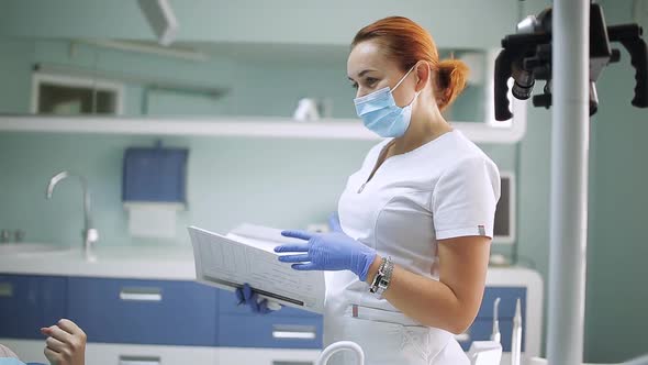 Health and Dental Care Woman at Work As Dentist and Doctor Meeting with Assistant and Talking with