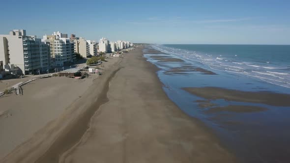 Aerial Drone view of empty beach with low tide, in Monte Hermoso, Argentina alt