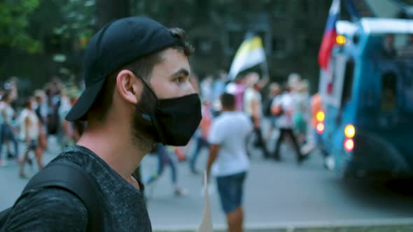 Rebel Man in Covid Facemask on Anti Government March in Protester Russian Group