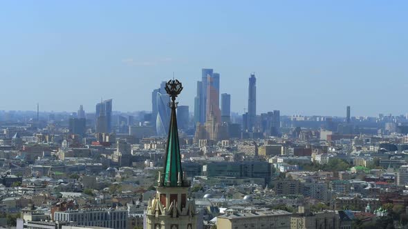 A Soviet Building with Skyscrapers in the Background alt