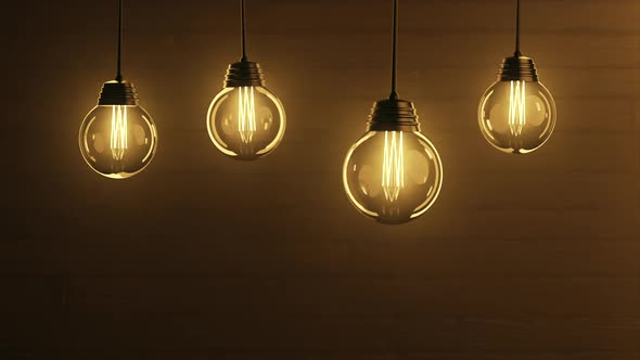 Golden Flicker Bulb Lights Bouncing on a Wire Flashing Lights Lanterns
