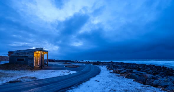Timelapse of Beach Cabin with Stormy Clouds and Sea alt