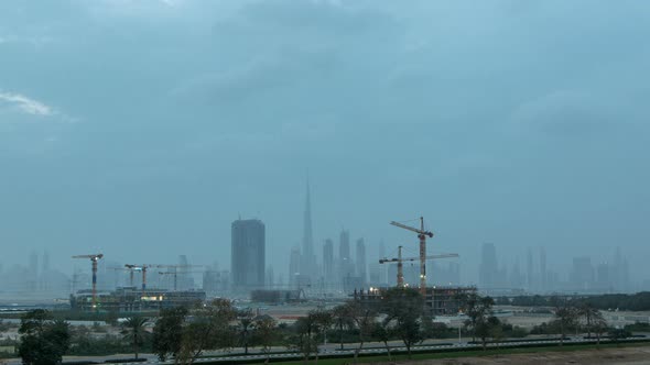 Skyline of Construction Cranes Tower with Skyscrapers on Background in the Middle East Day To Night alt
