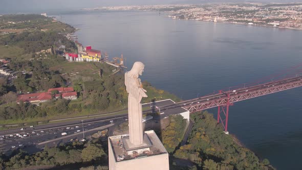 Aerial of the Christ monument near 25 de Abril Bridge