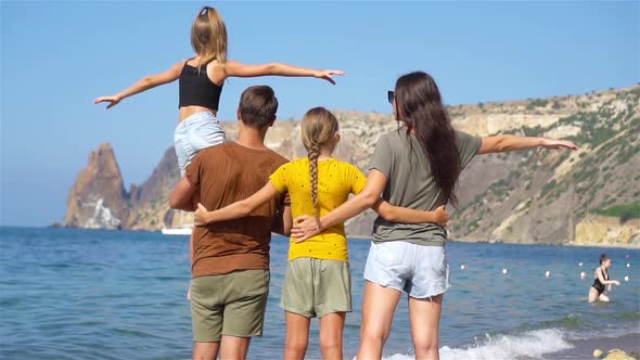 Young Family on Vacation Have a Lot of Fun