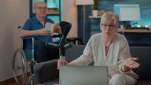 Senior Woman Using Laptop to Have Online Conversation alt