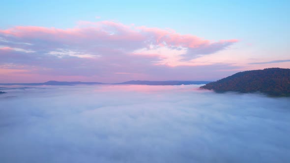 4K Drone Flying in the clouds. Flying through the clouds during sunrise alt