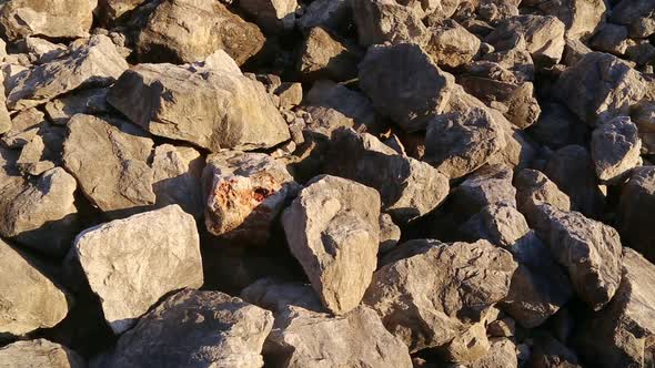 Stone and rock - close up. Heap of of crushed pieces used as natural building material alt