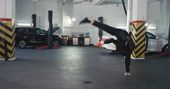 Happy Worker Mechanic Man in a Garage Dancing alt