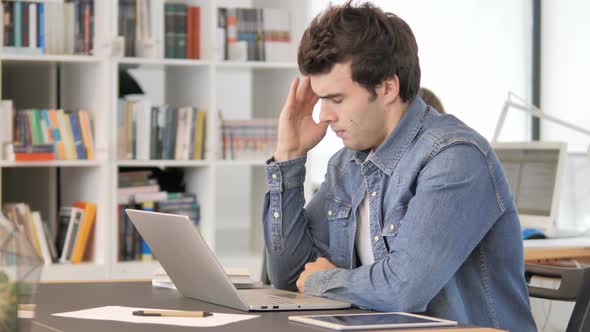 Headache, Creative Man with Pain in Head Working In Office alt