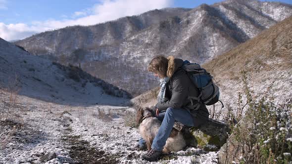 Girl with a Dog in the Mountains alt