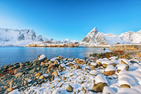 Fabulous winter view of Sakrisoy village and snowy mountaines on background. - Stock Photo - Images