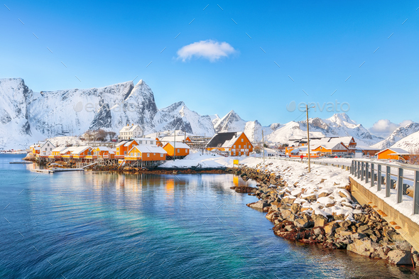 Fabulous winter view of Sakrisoy village and snowy mountaines on background. - Stock Photo - Images