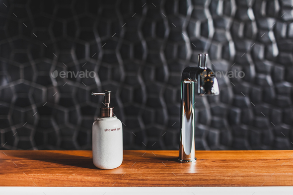 Download White Metal Bottle Of Shower Gel On Wooden Edge Of Bath In Modern Hotel Room Stock Photo By Olegbreslavtsev