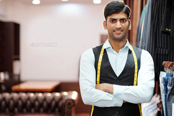 Young handsome Indian tailor