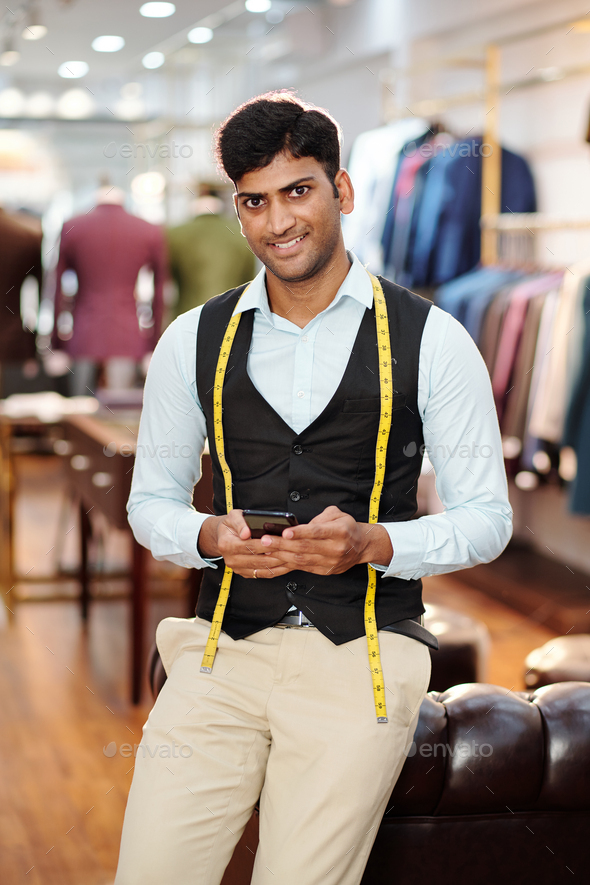Handsome young Indian tailor