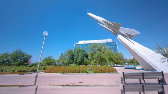 The MIG-21 Plane Is a Monument in the Square of Glory Timelapse Hyperlapse. Aktau, Kazakhstan alt