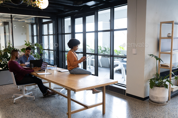 Diverse group of business people working in creative office - Stock Photo - Images