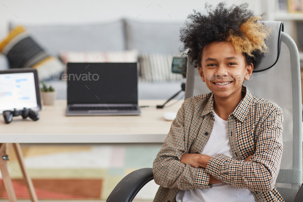 African-American Boy Posing with Gaming Laptop