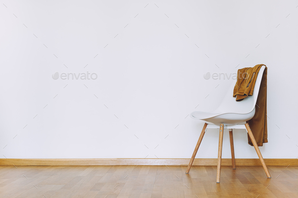Indoors flat wall mockup with Clothes on Chair