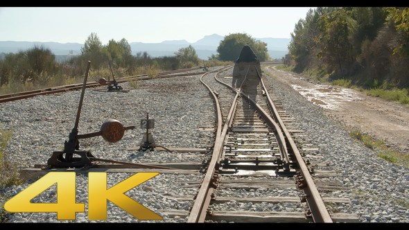 Man Walks By The Railroad  And Fades Away 01