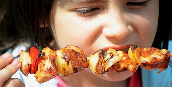 Girl Eating Skewers 1