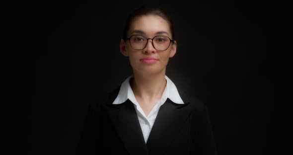 Business Woman with Glasses with a Serious Face Shows Nine Finger
