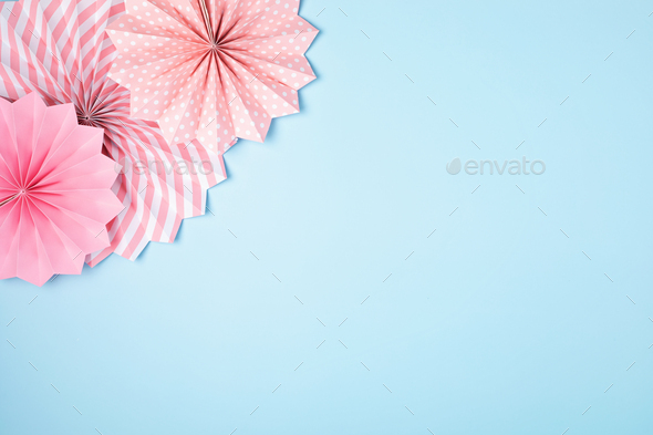 Festive party background with pink paper circle fans over pastel background.  Festival, birthday Stock Photo by OksaLy