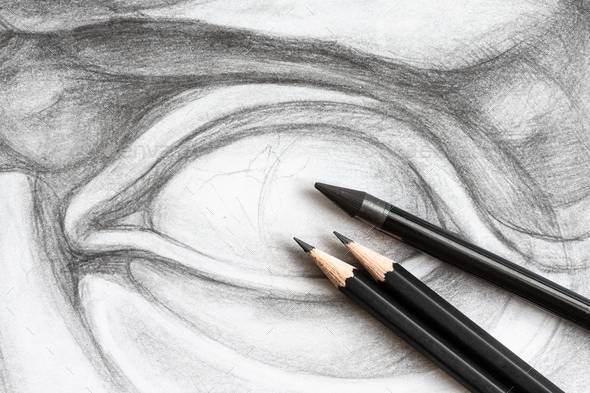 three graphite pencils on drawing of David\'s eye