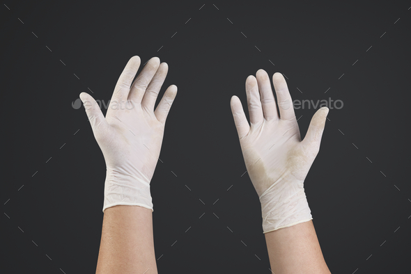 Medical gloves human hands using invisible screen - Stock Photo - Images