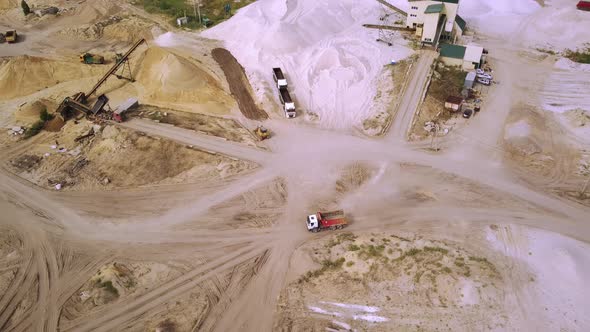 The Truck is Driving Through a Sand Quarry alt