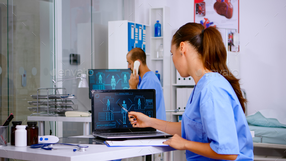 Student medical practitioner analysing human body digital scan