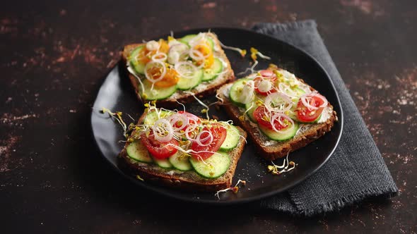 Healthy Toasts with Cucomber, Tomatoes and Crumbled Feta and Radish Sprouts alt