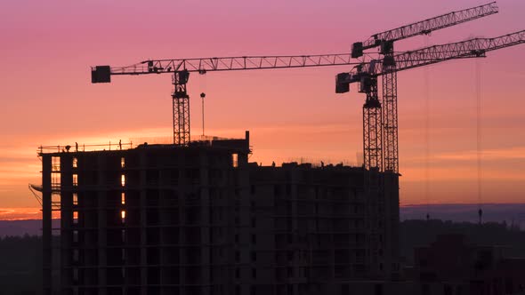 Building A House At Sunset