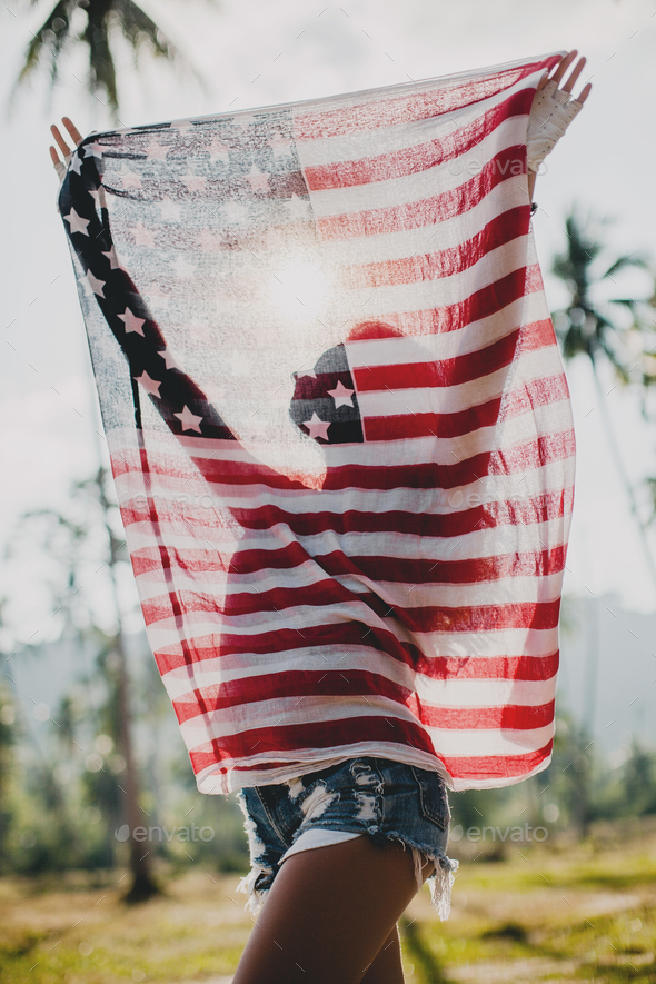 young sexy woman, passion, free spirit, vintage, hipster, holding american flag