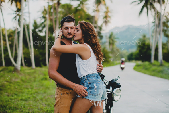 young couple in love, riding a motorcycle, hugs, passion, free spirit, vintage, hipster,