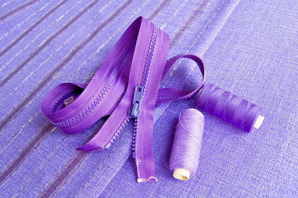 Locking zipper and thread on the purple fabric