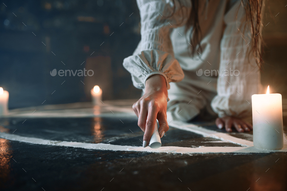 Woman sitting in magic circle, demons casting out
